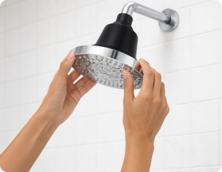 Ilume showerhead being threaded onto shower arm