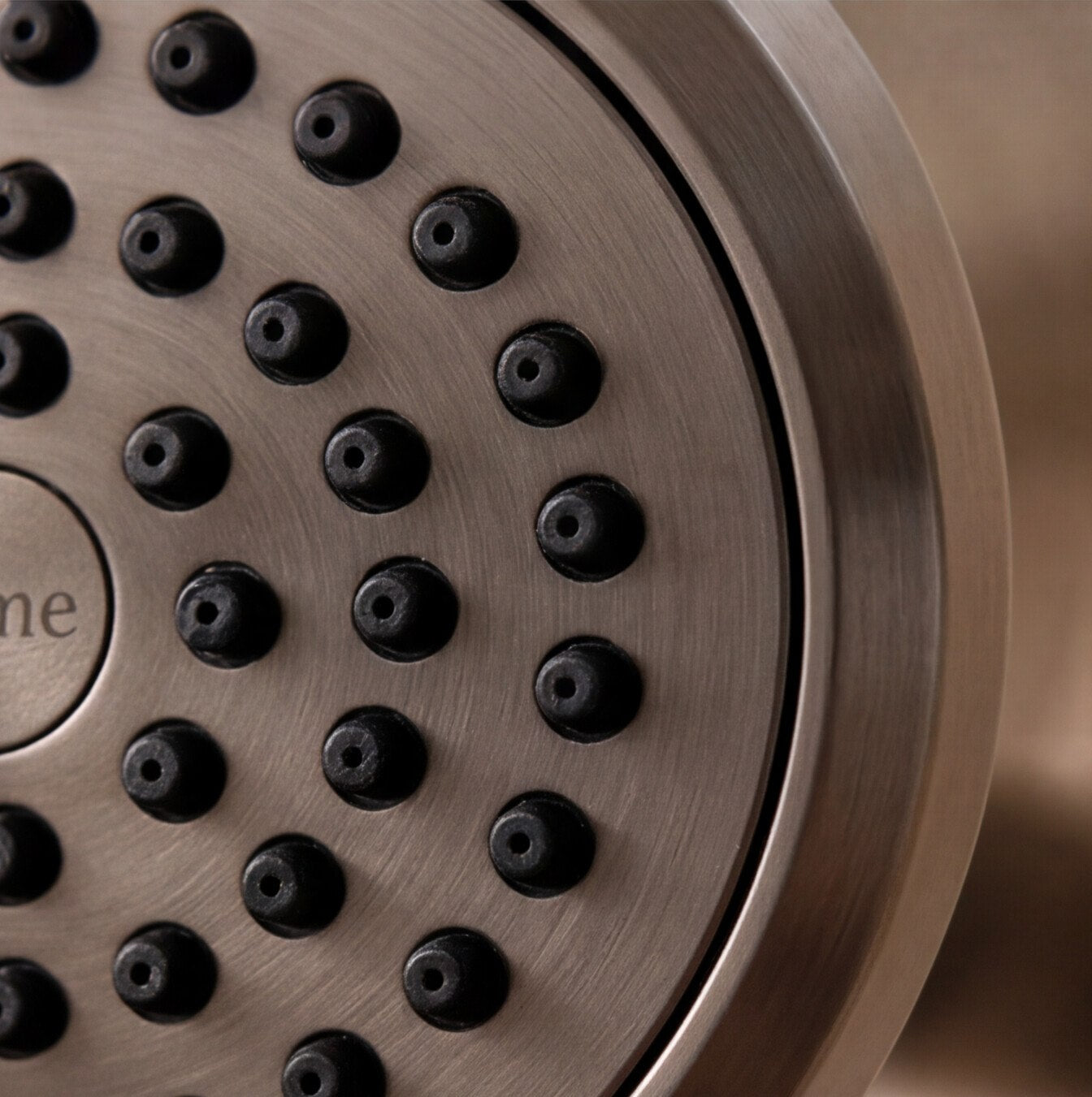 Close-up of the Ilume spray face and brushed brass finish